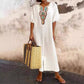 Casual and loose-fitting dress for women, made of cotton and linen with embroidery and a slit.