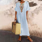 Casual and loose-fitting dress for women, made of cotton and linen with embroidery and a slit.
