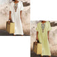 Casual and loose-fitting dress for women, made of cotton and linen with embroidery and a slit.