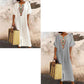 Casual and loose-fitting dress for women, made of cotton and linen with embroidery and a slit.